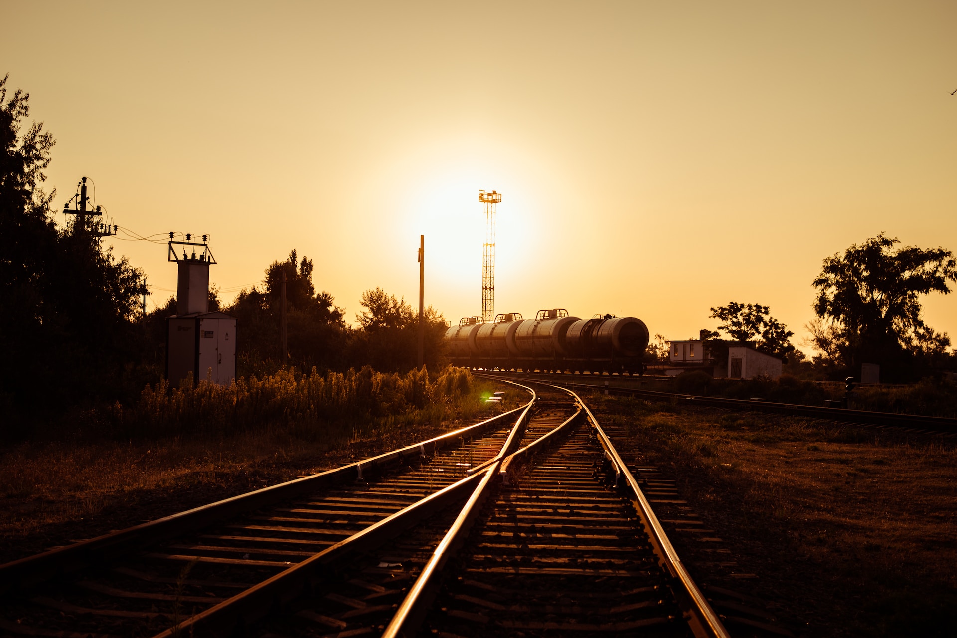 Tran tracks merging into one track as the sun sets.